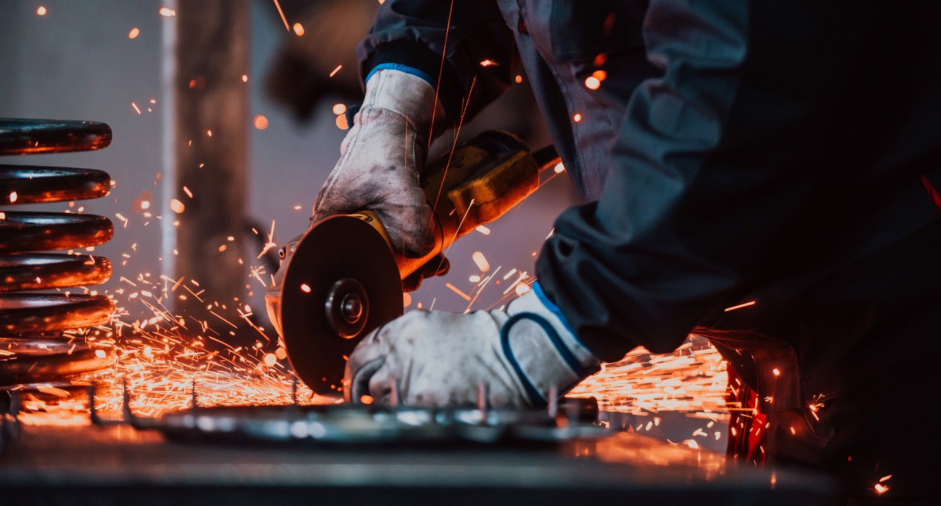 person operating an angle grinder